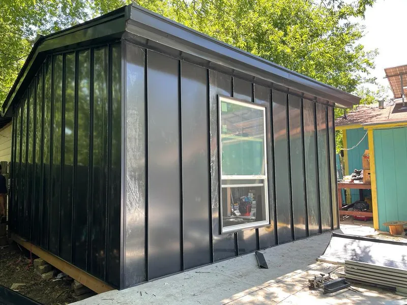 Black standing seam metal wall panels for Roof Inspection in St. Paul Park
