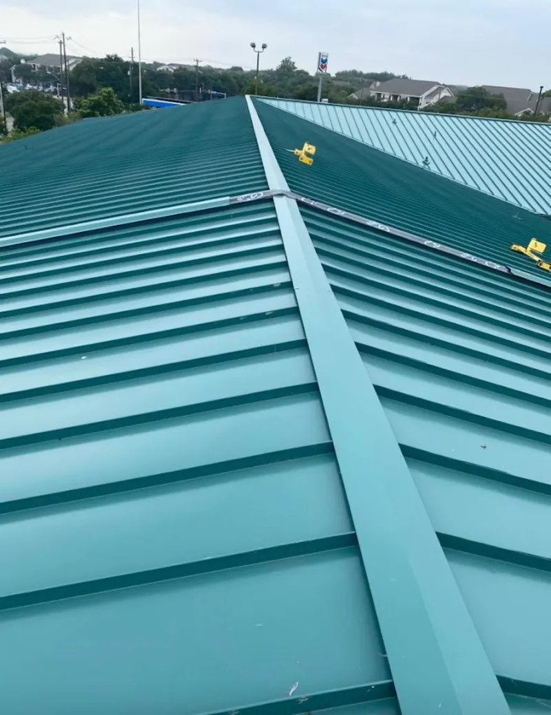 Green commercial metal roof ridge and valley for Metal Roof Repair in St. Paul Park