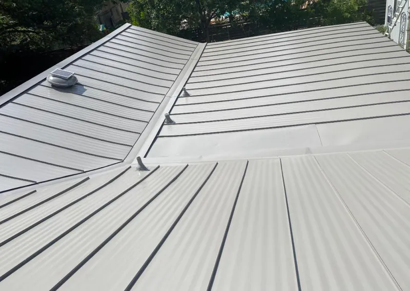 Solar attic fan installed on a metal roof for Roof Ventilation in St. Paul Park